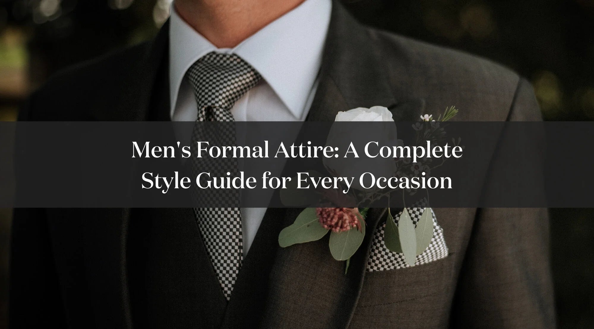 Close-up of a men’s formal ceremony suit with tie, pocket square and floral boutonniere.