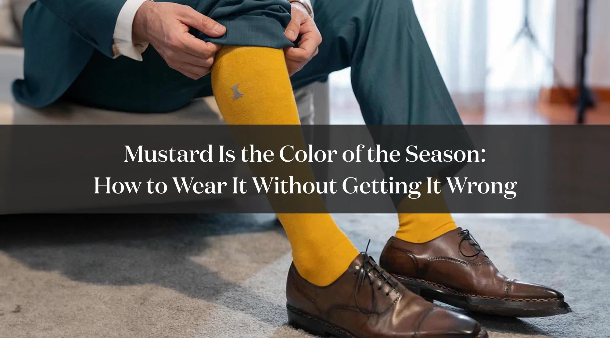 Detail of a mustard sock worn with brown dress shoes, with text about how to style the mustard color.
